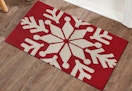 white snowflake on red bases doormat