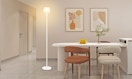 a floor lamp in a room next to a table and chairs