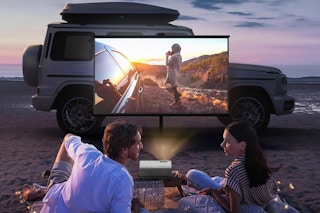 a couple by a mini projector