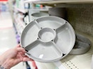 hand grabbing a serving platter set off a target shelf