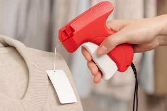 a woman using a stitch gun