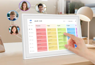 hand touching a white digital calendar