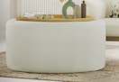 cream colored stowaway coffee table