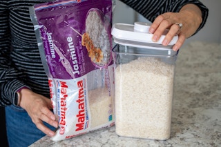 Rice being sealed into an air tight container