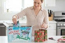a woman unpacking frosted cookies