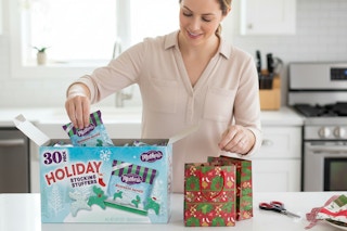 a woman unpacking frosted cookies