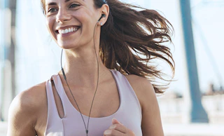 a person wearing wired headphones