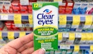 hand holding box of Clear Eyes eye drops in aisle