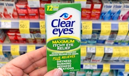 hand holding box of Clear Eyes eye drops in aisle