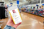 hand holding a smartphone displaying a 1-clip coupon deal in the kcl app