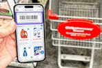 someone holding a phone showing the Coupon24 app at CVS