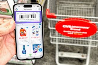 someone holding a phone showing the Coupon24 app at CVS