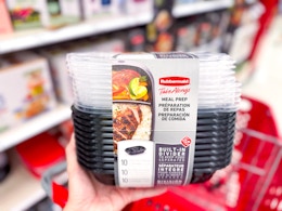 hand holding a rubbermaid meal prep set in front of a target cart