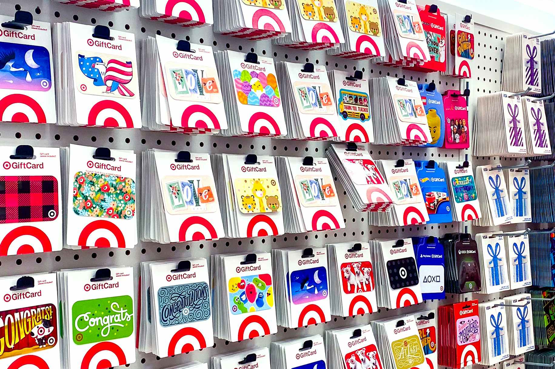various themed target gift cards on display in store near shopping cart