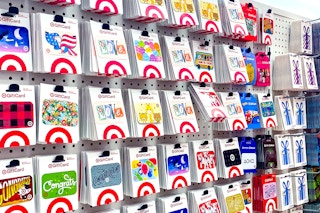 various themed target gift cards on display in store near shopping cart