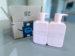 Monday shampoo set next to Prime box