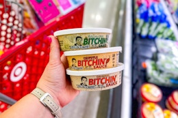 hand holding 3 bitchin sauce dip at target