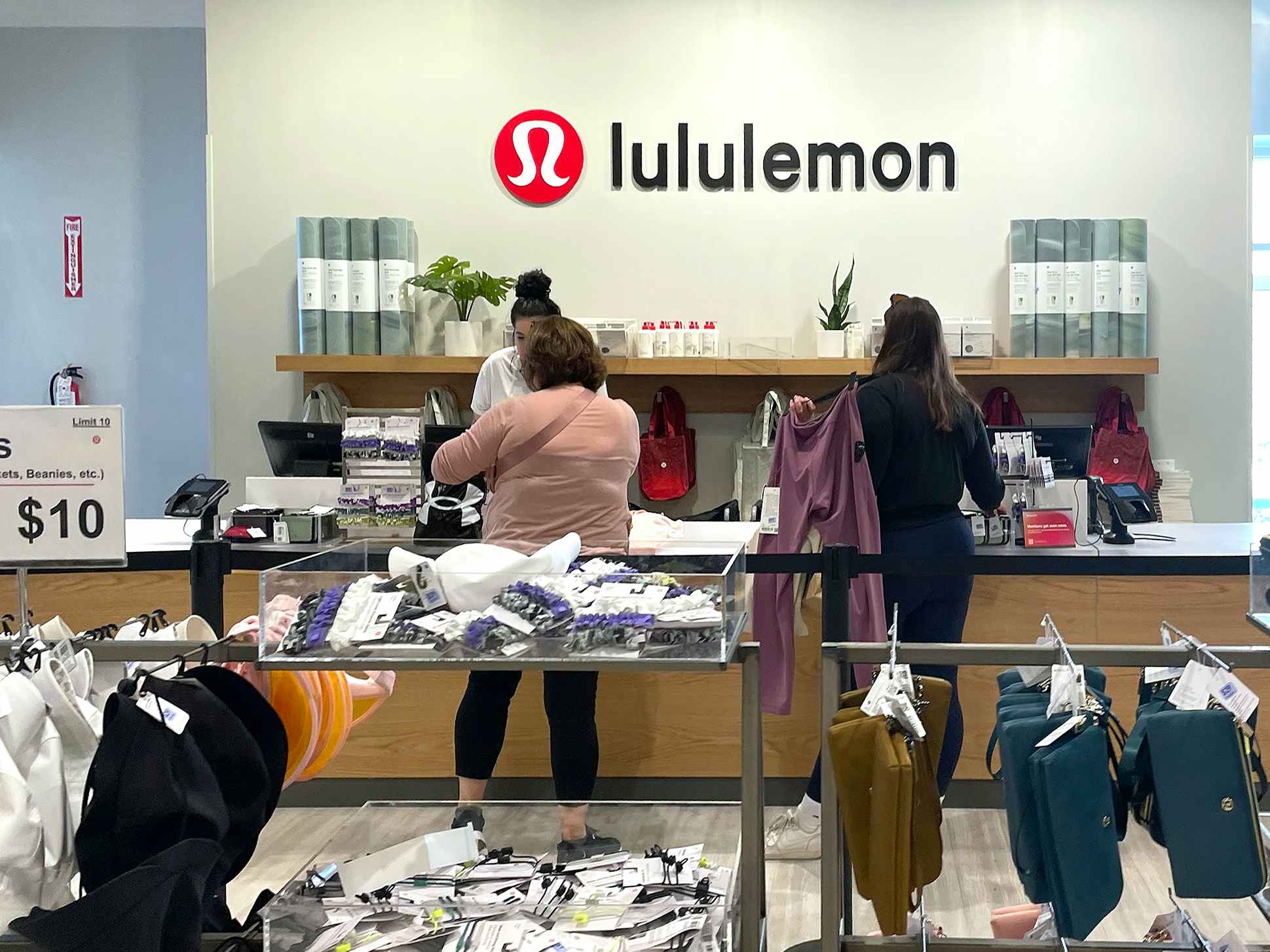 people checking out at lululemon outlet store