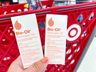 hand holding two boxes of Bio-Oil Skincare oil