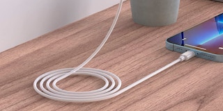 An iPhone charging on a table
