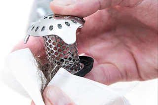 a man cleaning a tubshroom