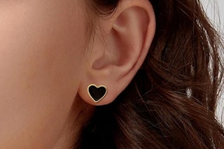 heart shaped earrings being worn