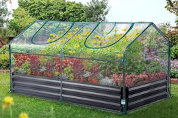 a clear greenhouse in a field