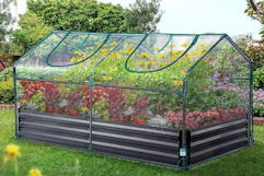 a clear greenhouse in a field