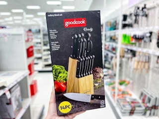 hand holding a natural wood knife block set