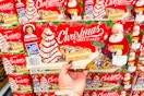 hand holding a box of little debbie christmas tree cakes
