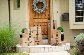 amazon boxes sitting on a front porch