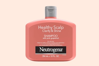 a drop of shampoo next too a shampoo bottle