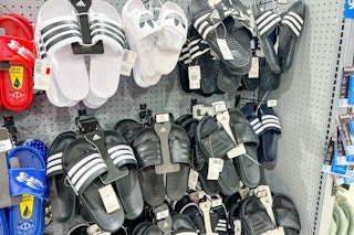 adidas slide hanging up on rack in store