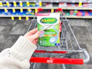 hand holding a box of polident tablets