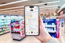hand holding a smartphone with the kcl app showing a 1-clip coupon deal