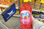 hand holding a bottle of v8 splash juice