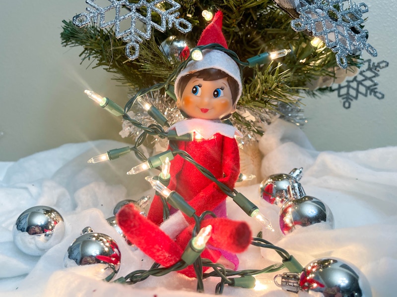 elf on the shelf doll tangled in a string lights 