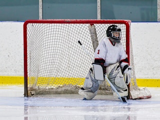 a young hockey goalie playing in net