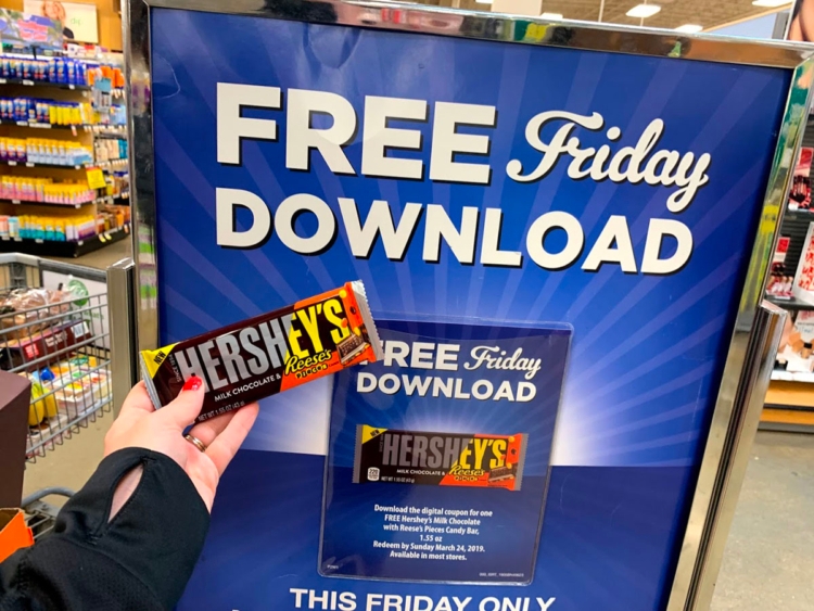 Free candy bar in front of Free Friday Download sign 