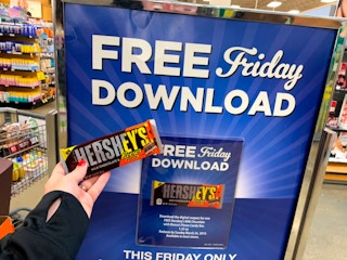 Free candy bar in front of Free Friday Download sign 