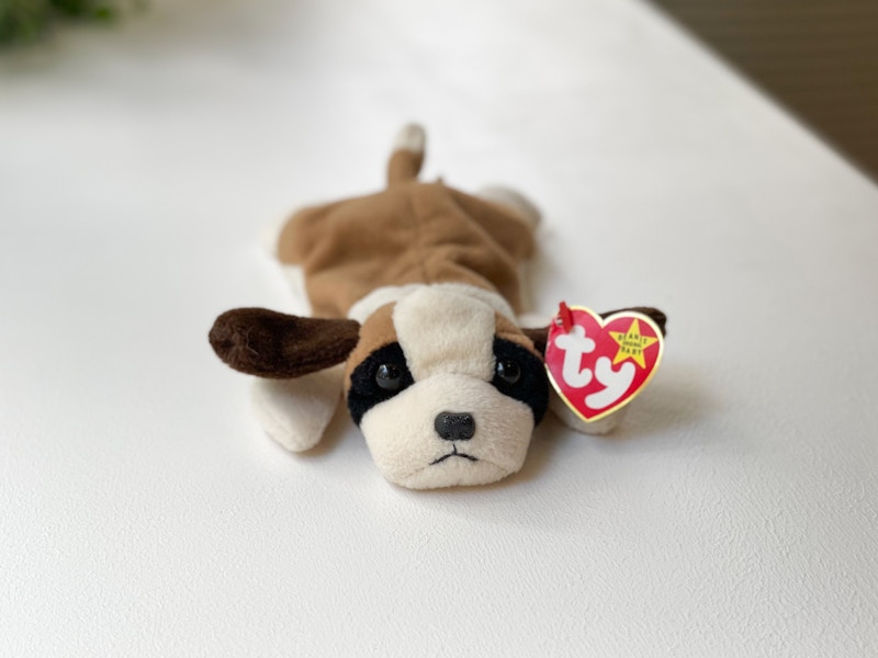 A Bernie the Saint Bernard Dog beanie baby on a white table.