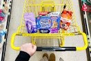 chips ahoy, skintimate, colgate, dunkin in a yellow shopping cart