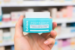 hand holding bliss moisturizer