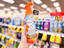 hand holding febreze air mist in cvs