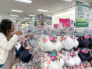 A woman shopping for bra's at Kohls
