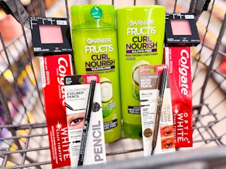 shopping cart with Garnier Fructis hair care, Colgate toothpaste, Maybelline Blush and Revlon eye pencils