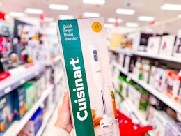 hand holding a cuisinart hand blender in a target aisle