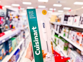 hand holding a cuisinart hand blender in a target aisle