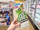 hand holding a box of yoplait gogurt protein tubes
