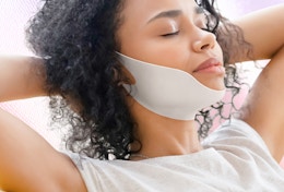 a person with a v-line face mask on